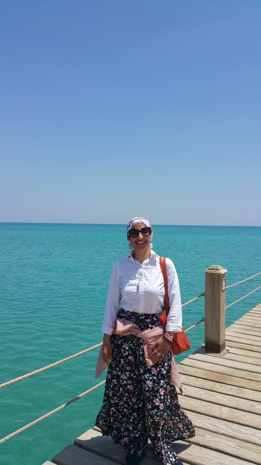 Abeer standing on seashore in Egypt.