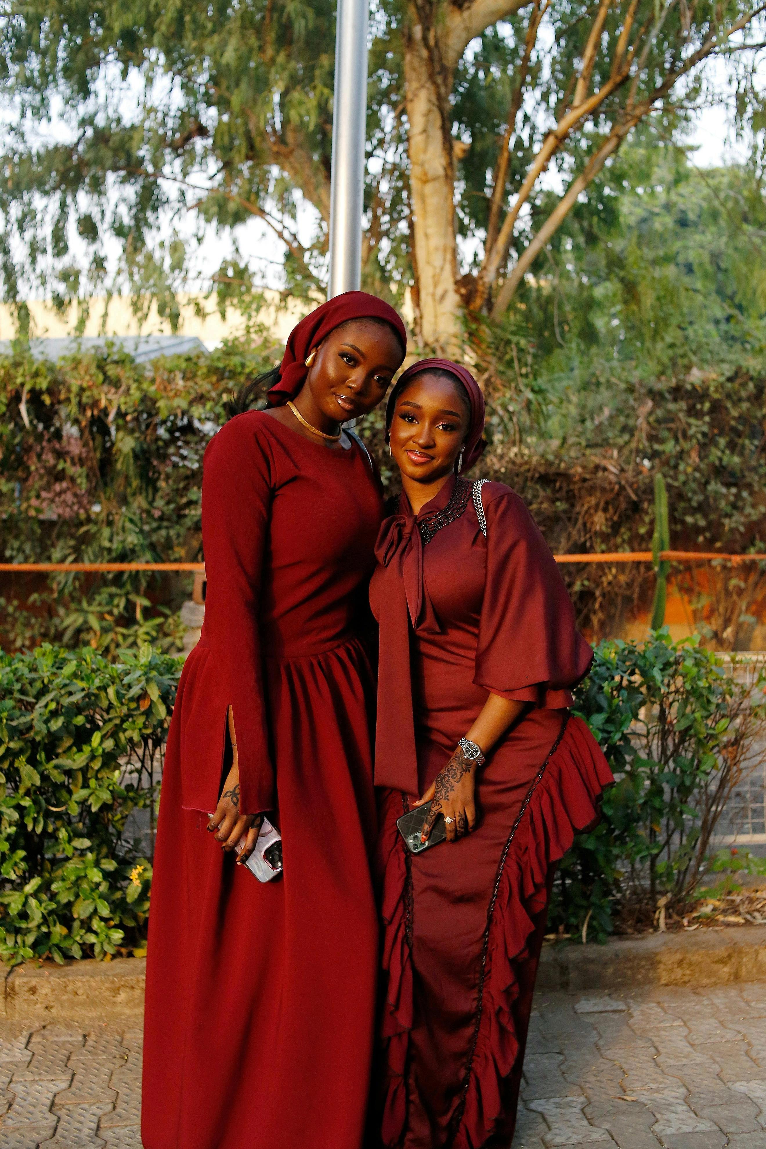 Two Muslim women wearing a bright and fashionable dresses.